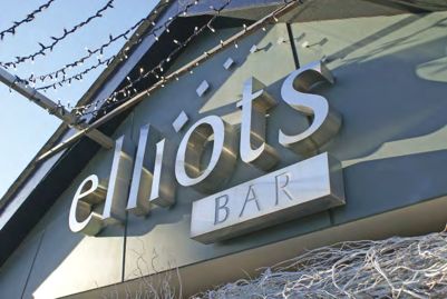Sign saying Elliots bar using built-up letters.